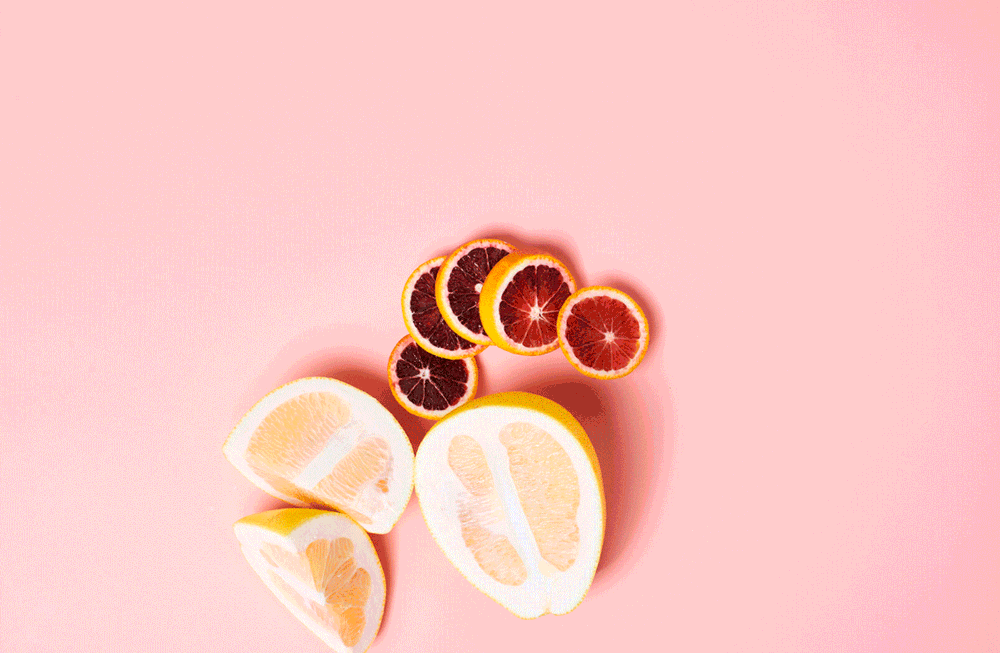 Citrus giff on pink by commercial food photographer Sarah Flotard  